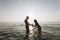 Couple playing in the water Royalty Free Stock Photo