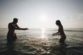 Couple playing in the water Royalty Free Stock Photo