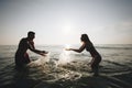 Couple playing in the water Royalty Free Stock Photo