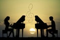 Couple plays the piano at sunset