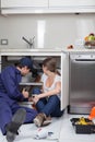 Couple plumbers fixing the pipes Royalty Free Stock Photo