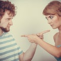 Couple pointing fingers at each other, conflict Royalty Free Stock Photo