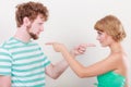 Couple pointing fingers at each other, conflict Royalty Free Stock Photo