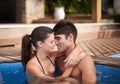 Couple, pool and hug outdoor, love and connection with forehead touch and summer vacation at hotel. Happy people Royalty Free Stock Photo