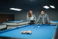 couple of pool players standing at the side of the pool Royalty Free Stock Photo