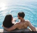 A couple in pool spending time together