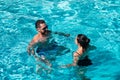 Couple in pool. Summer pool resort. Life winner. Butt in bikini. Pool party.