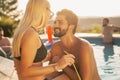 Couple at a poolside party Royalty Free Stock Photo