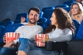 couple with popcorn and soda drink watching film together Royalty Free Stock Photo