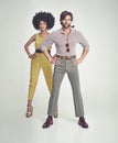 Couple, portrait and fashion in confidence with pipe for smoking, style or outfit on a gray studio background Royalty Free Stock Photo