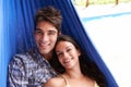 Couple, portrait and hammock relax on holiday for summer vacation in Hawaii for honeymoon, bonding or stress relief. Man Royalty Free Stock Photo