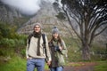 Couple, portrait and hiking on mountain or holding hands with travel, adventure or holiday for experience or love. Man