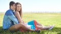 Couple, portrait and hug in nature, romance and care in relationship on outdoor date. Happy people, embrace and relax on Royalty Free Stock Photo