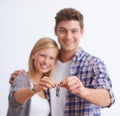 Couple, portrait and keys for new home in studio for property investment, real estate or purchase. Man, woman and hands Royalty Free Stock Photo