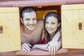 Couple portrait of lovers in swimwear looking out