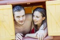 Couple portrait of lovers in swimwear looking out