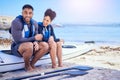 Couple, portrait and outdoor for kayak or travel at a beach with a partner for teamwork. A happy man and woman with a Royalty Free Stock Photo