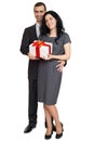 Couple posing with gift box, people dressed in classic black suit, isolated on white background Royalty Free Stock Photo
