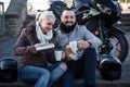 Couple posing near motor bike Royalty Free Stock Photo