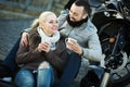 Couple posing near motor bike Royalty Free Stock Photo