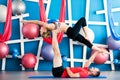 Couple practicing acro yoga in a studio. Acro yoga concept. Couple yoga class