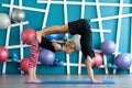 Couple practicing acro yoga in a studio. Acro yoga concept. Couple yoga class