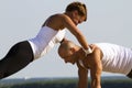 Couple practising on the early morning sun Royalty Free Stock Photo