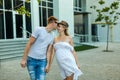 Couple With Pregnant Wife walking in a city street Royalty Free Stock Photo