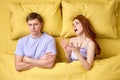 Couple With Problems Having Disagreement In Bed, Quarrelling Royalty Free Stock Photo