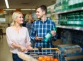 Couple purchasing mineral water Royalty Free Stock Photo