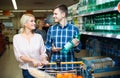 Couple purchasing mineral water Royalty Free Stock Photo