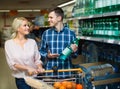 Couple purchasing mineral water Royalty Free Stock Photo