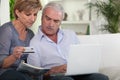 Couple purchasing over the internet Royalty Free Stock Photo