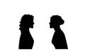 Silhouette of two women angry and shouting face to face