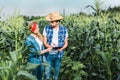 couple of ranchers checking harvest with clipboard in field Royalty Free Stock Photo