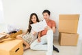 couple read blueprint for new house interior