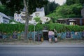 Man and Woman review a restaurant menu at the entrance to an open air wine garden in Cochem, Germany