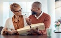 Couple reading bible, home faith and talking about religion with coffee for learning, study and education. Black man