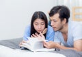 Couple reading a book together in bedroom on the morning with ha Royalty Free Stock Photo