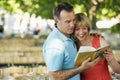 Couple Reading Guidebook Royalty Free Stock Photo