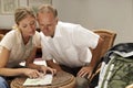 Couple Reading Map At Home Royalty Free Stock Photo