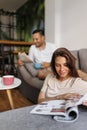 Couple reading newspaper and drinking coffee Royalty Free Stock Photo