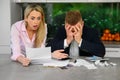 Couple reading terrible news regarding their finances Royalty Free Stock Photo