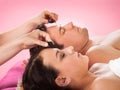 Couple Receiving Hot Stone Massage At Spa Royalty Free Stock Photo