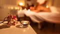 Couple Receiving Massage Indoor, Spa Composition With Candle And Flowers Royalty Free Stock Photo