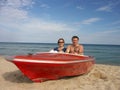 Couple in red motorboat Royalty Free Stock Photo