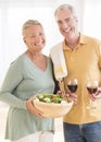 Couple With Red Wineglass And Salad At Home