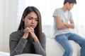 couple relationship problems. Sad young wife sitting on the bed back to back from husband after argument Royalty Free Stock Photo