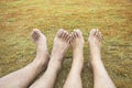 Couple Relax barefoot happy nature lawn on the grass in brown tone Royalty Free Stock Photo