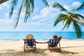 Couple relax on the beach enjoying beautiful sea on the tropical island Royalty Free Stock Photo